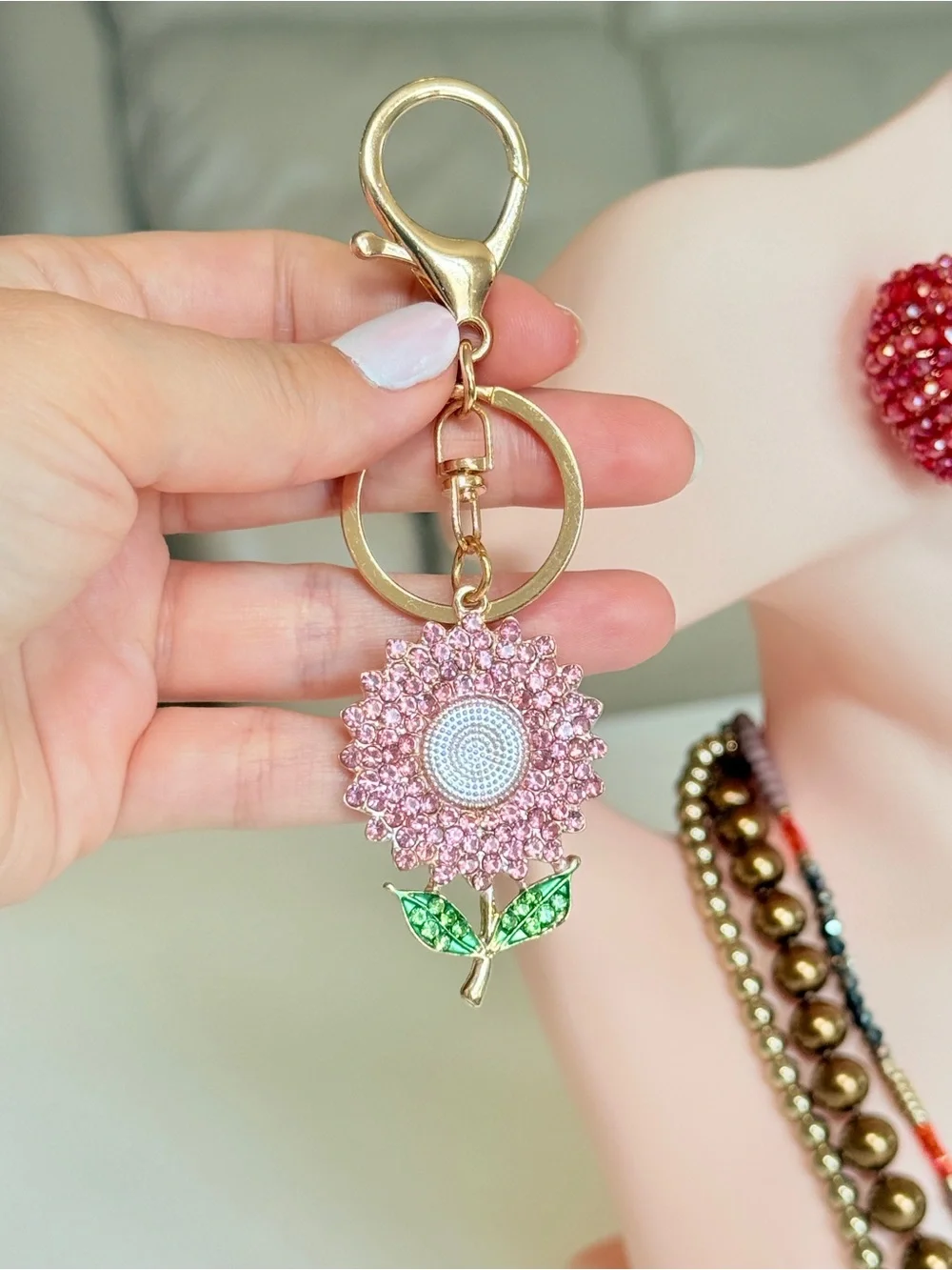 Gold-Tone Pink Crystal Sunflower Keychain with Green Leaves